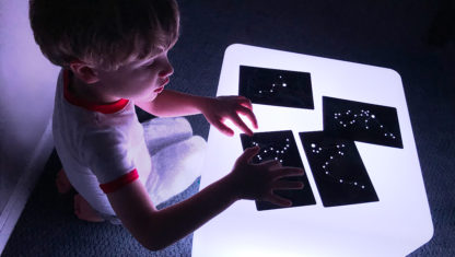 Image of Roylco Constellations Cards held by child on Educational Light Cube